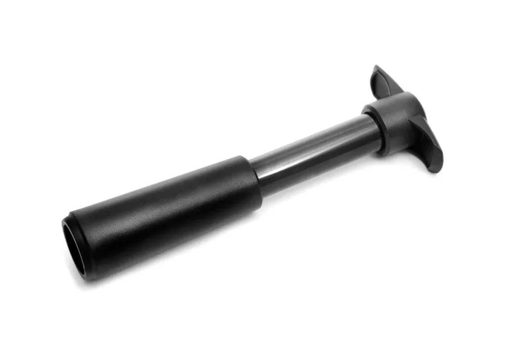 Black handheld vacuum pump used to remove air from an opened wine bottle