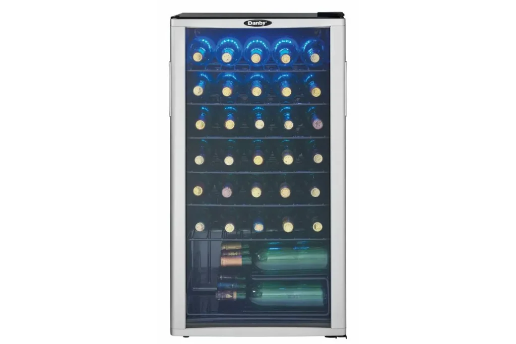 Freestanding wine refrigerator with glass door, blue interior light and shelves full of bottles
